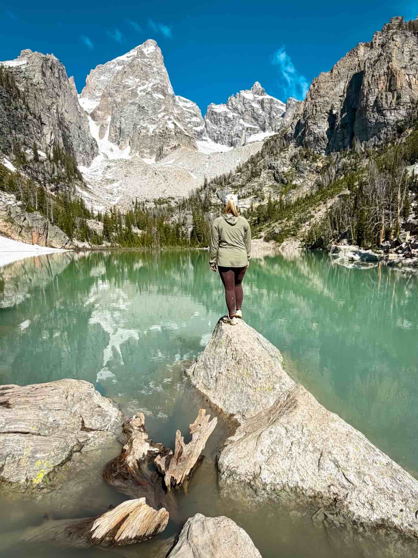 Taylor standing at lake in Grand Teton National Park